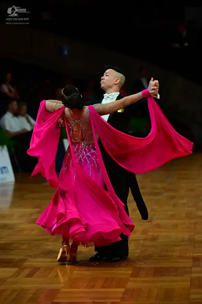 Dancesport competitor: Male dancer: black suit with a white shirt and white bowtie