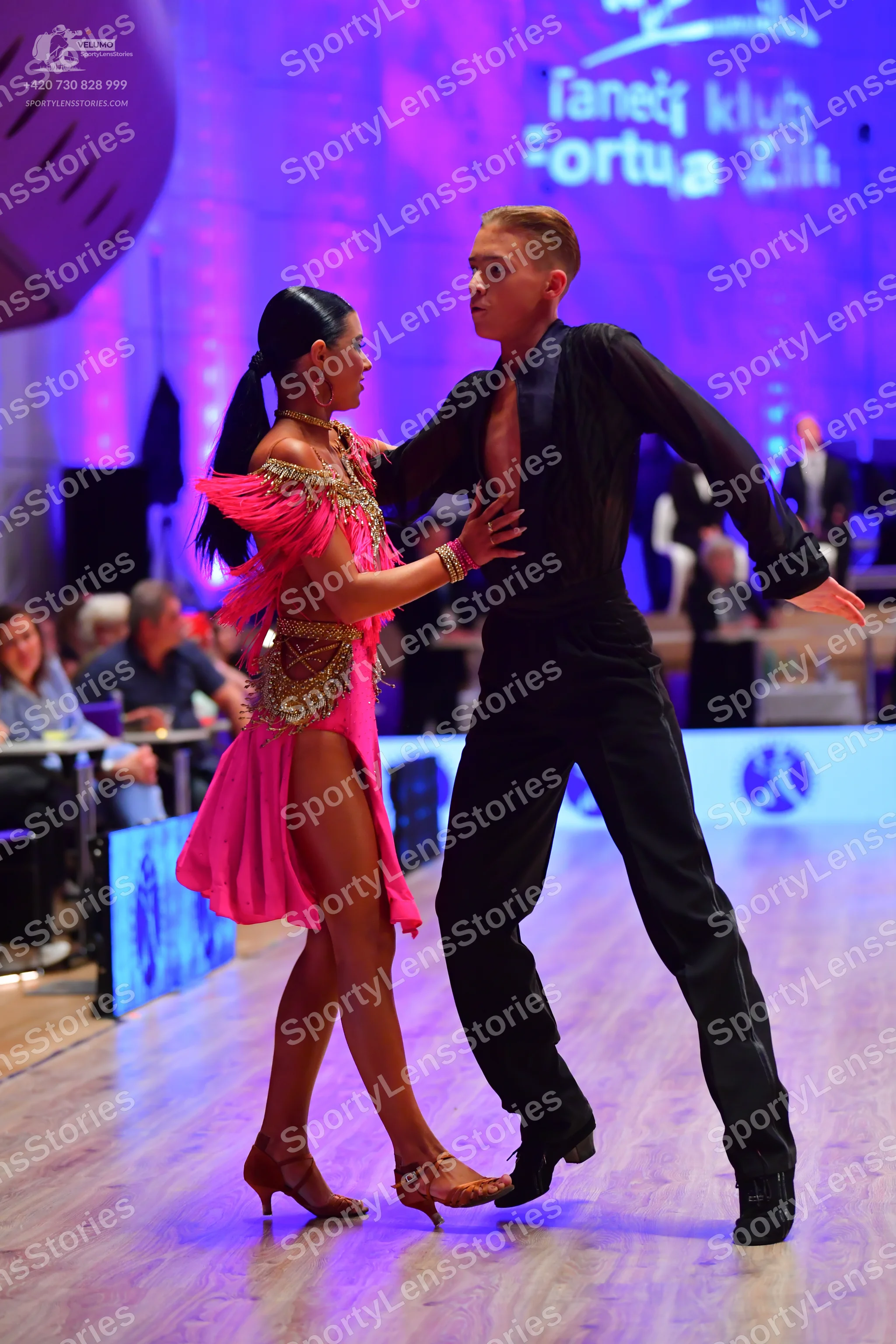Dancesport competitor: Male dancer: black long-sleeved shirt and trousers