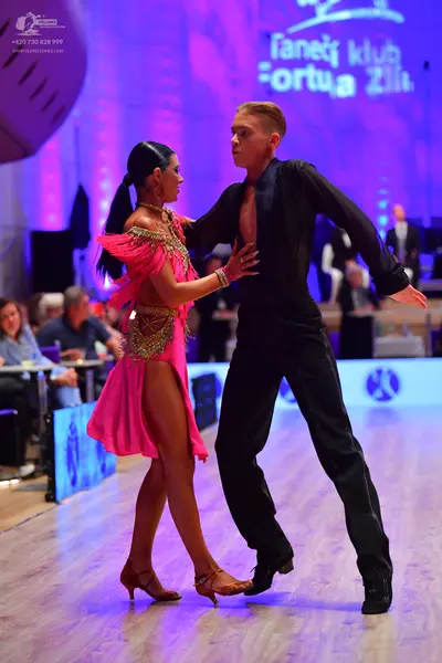 Dancesport competitor: Male dancer: black long-sleeved shirt and trousers