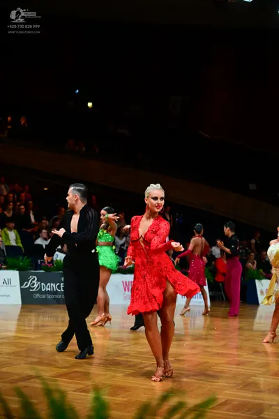 Dancesport competitor: Male dancer: black long-sleeved shirt and black trousers