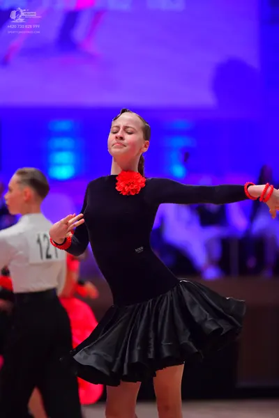 Dancesport competitor: Male dancer: white long-sleeved shirt and black trousers