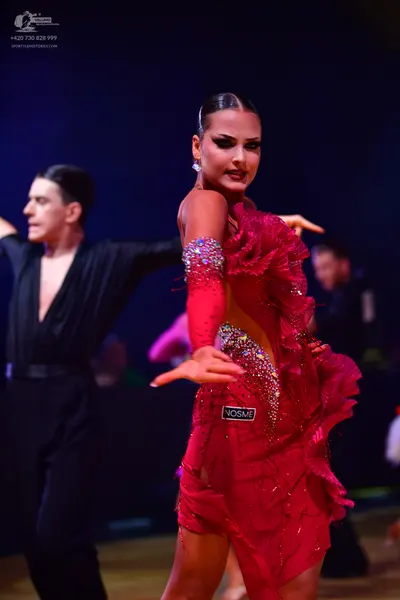 Dancesport competitor: Male dancer: black long-sleeved shirt and black trousers