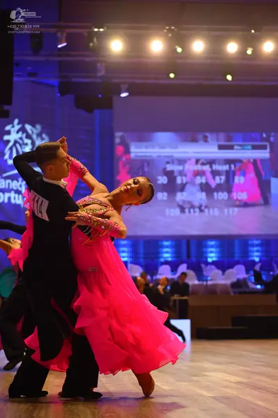 Dancesport competitor: Male dancer: black long-sleeved top and black trousers