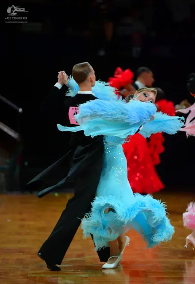 Dancesport competitor: Male dancer: black ballroom suit