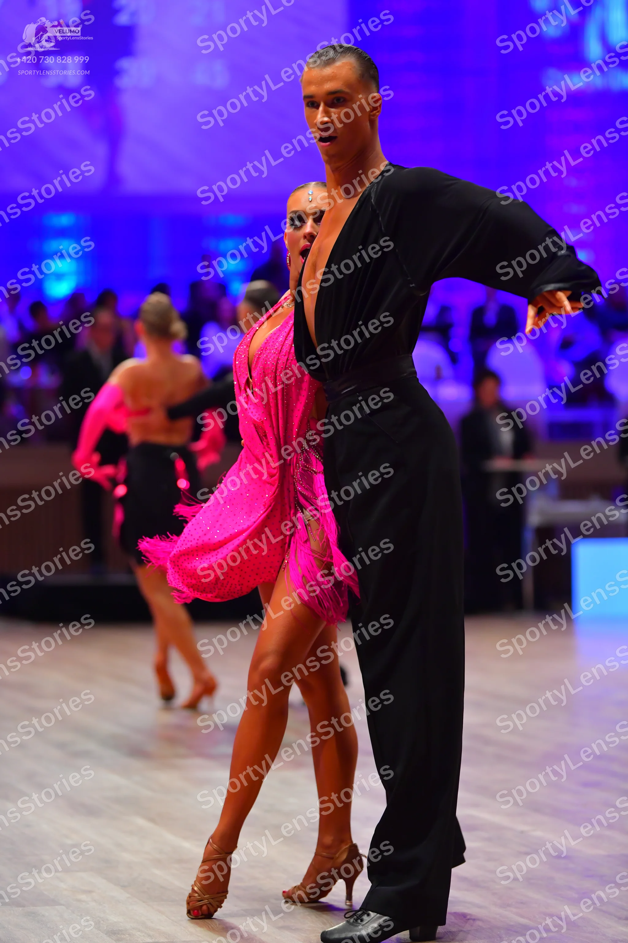 Dancesport competitor: Male dancer: black long-sleeved dance outfit with trousers