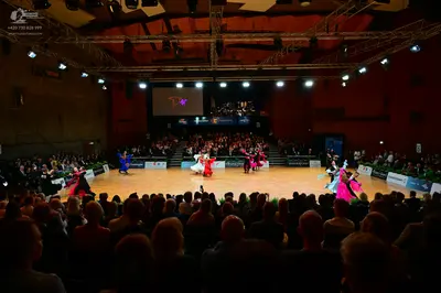 Dancesport competitor: Female dancers: various Latin dresses in colors including blue, red and black, w
