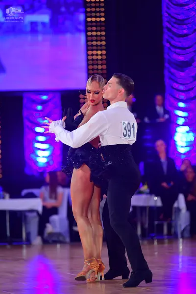 Dancesport competitor #391: Male dancer: white long-sleeved shirt and black trousers