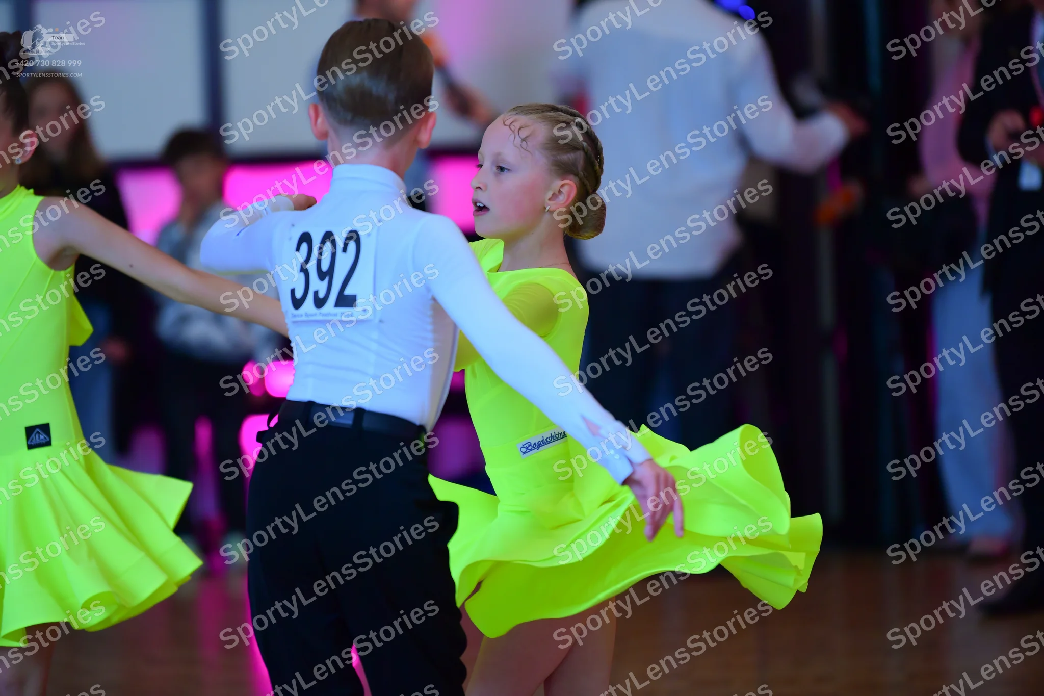 Dancesport competitor #392: Male dancer: white long-sleeved shirt and black trousers