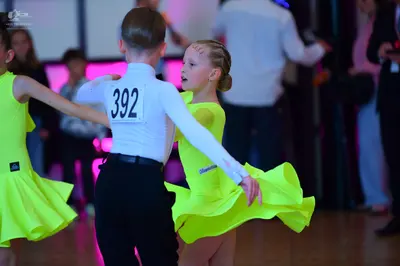 Dancesport competitor #392: Male dancer: white long-sleeved shirt and black trousers