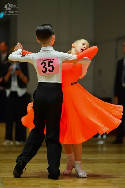 Dancesport competitor #35: Male dancer: white long-sleeved shirt and black trousers