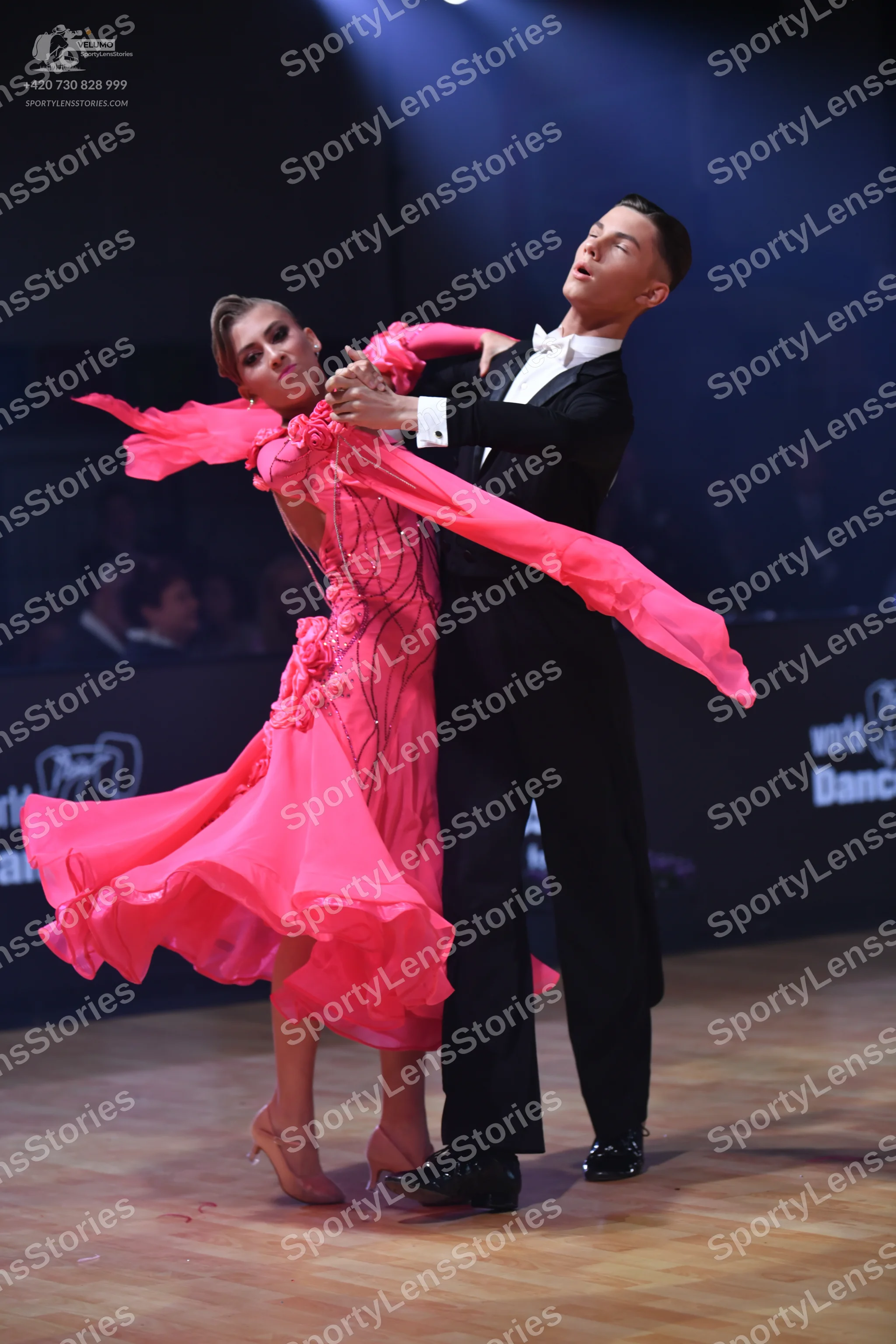 Dancesport competitor: Male dancer: black suit with a white shirt and white bow tie