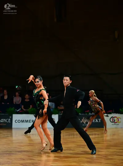 Dancesport competitor: Male dancer: black long-sleeved dance shirt and black trousers
