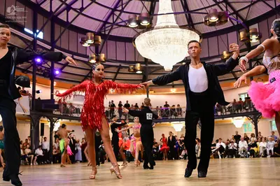 Dancesport competitor #14: Male dancer on left: black suit