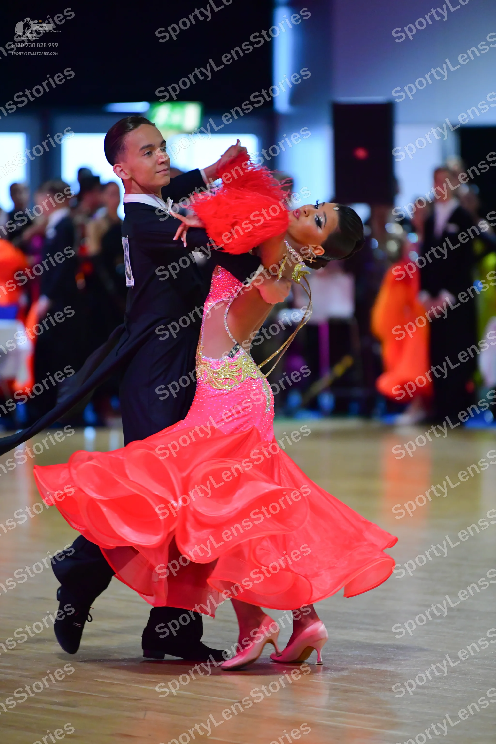 Dancesport competitor: Male dancer: black suit with a white shirt