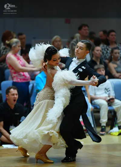 Dancesport competitor #185: Male dancer: black suit with a white shirt and bow tie