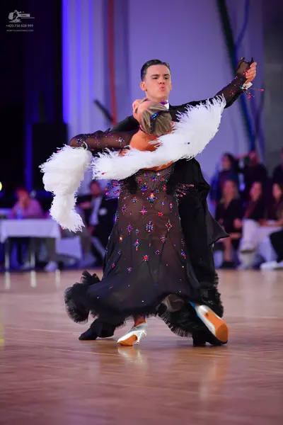 Dancesport competitor: Male dancer: black suit
