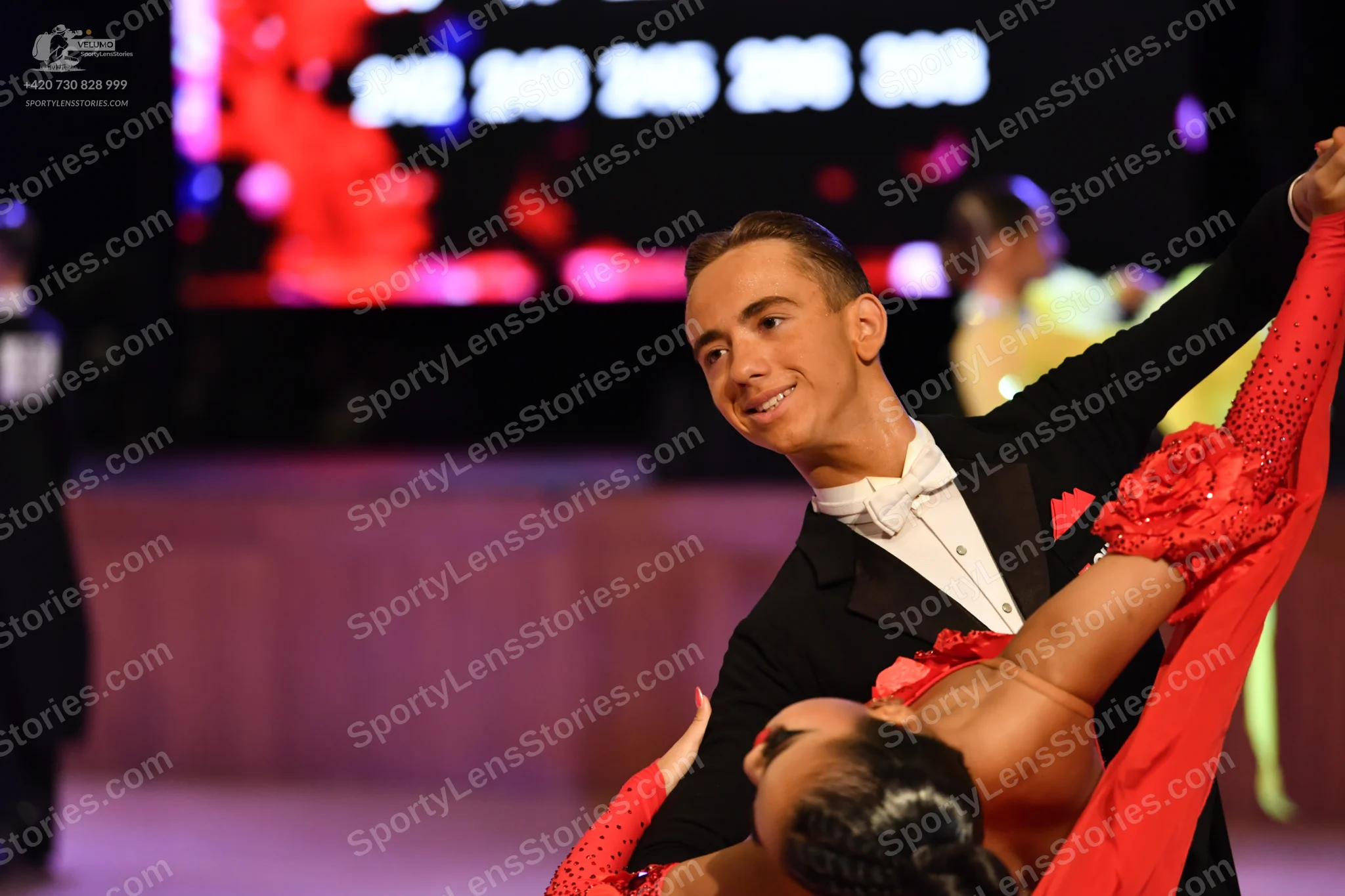 Dancesport competitor: ** Male: Black tail suit with white sequin lapels and a white shirt with a black