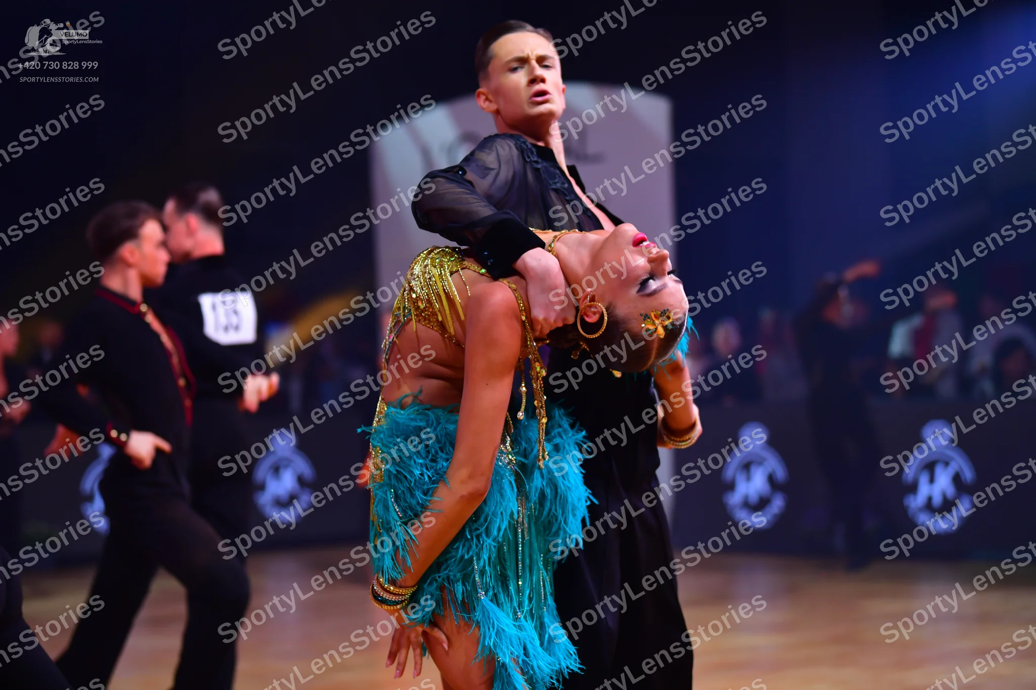 Dancesport competitor: Male dancers: black long-sleeved shirts and black trousers