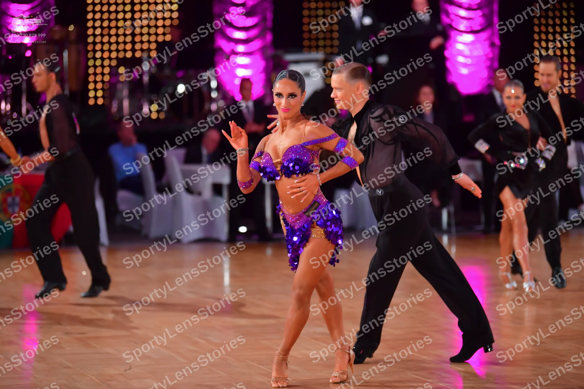 Dancesport competitor: Male dancer (left): black long-sleeved shirt and black trousers