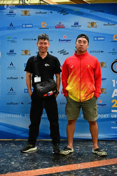 Dancesport competitor: There are no dancers in dance costumes visible in this image