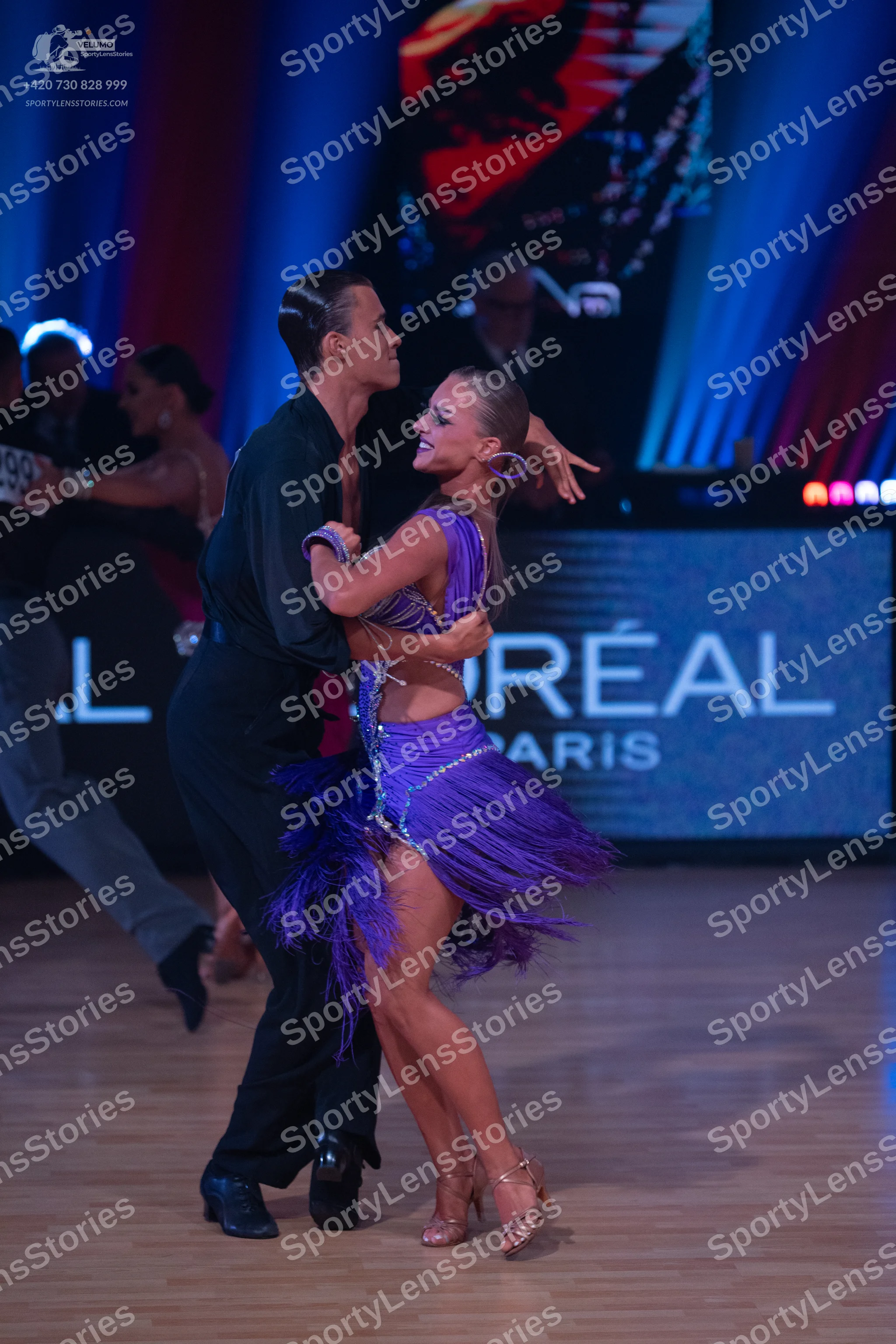 Dancesport competitor: Male dancer: black long-sleeved shirt and black trousers