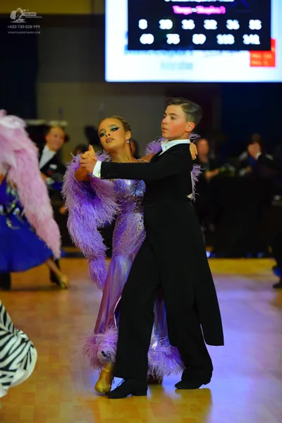 Dancesport competitor: Male dancer: black suit