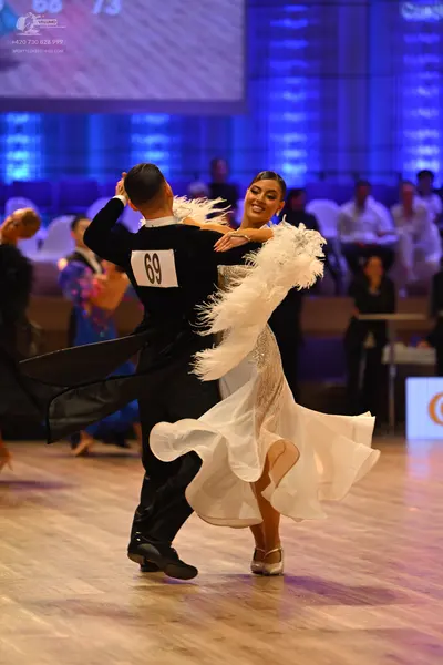 Dancesport competitor: Male dancer: black long-sleeved shirt and black trousers