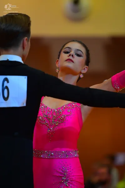 Dancesport competitor: Male dancer: black long-sleeved top