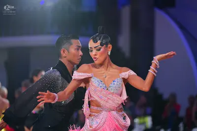 Dancesport competitor: Male dancer: black long-sleeved top with silver sequins
