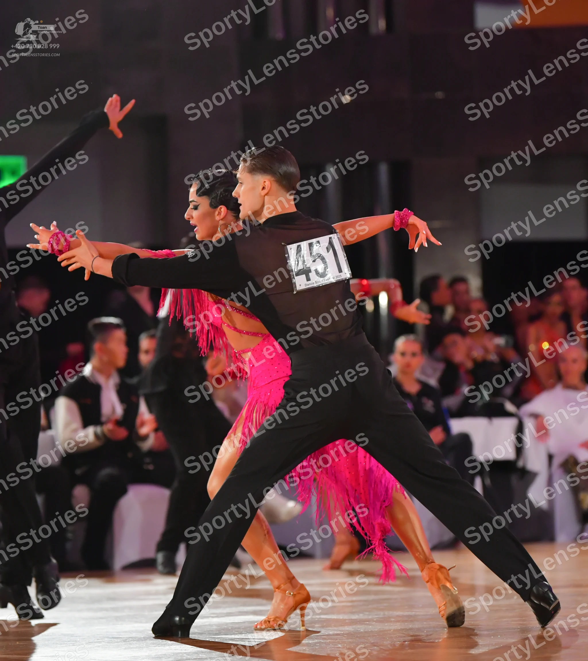 Dancesport competitor: ** Black tailsuit with sequin lapels