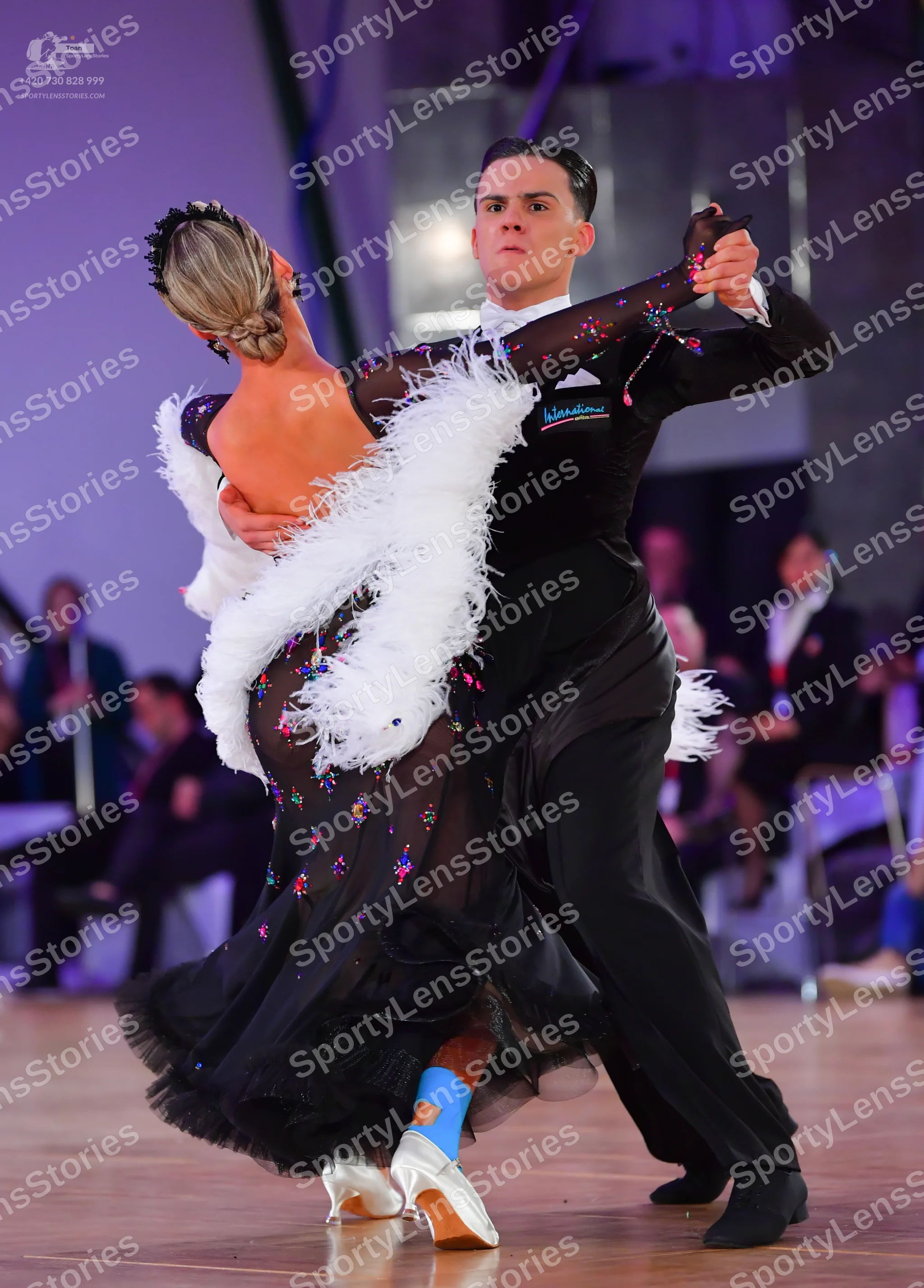 Dancesport competitor: Male dancer: black suit with a white shirt and black bow tie