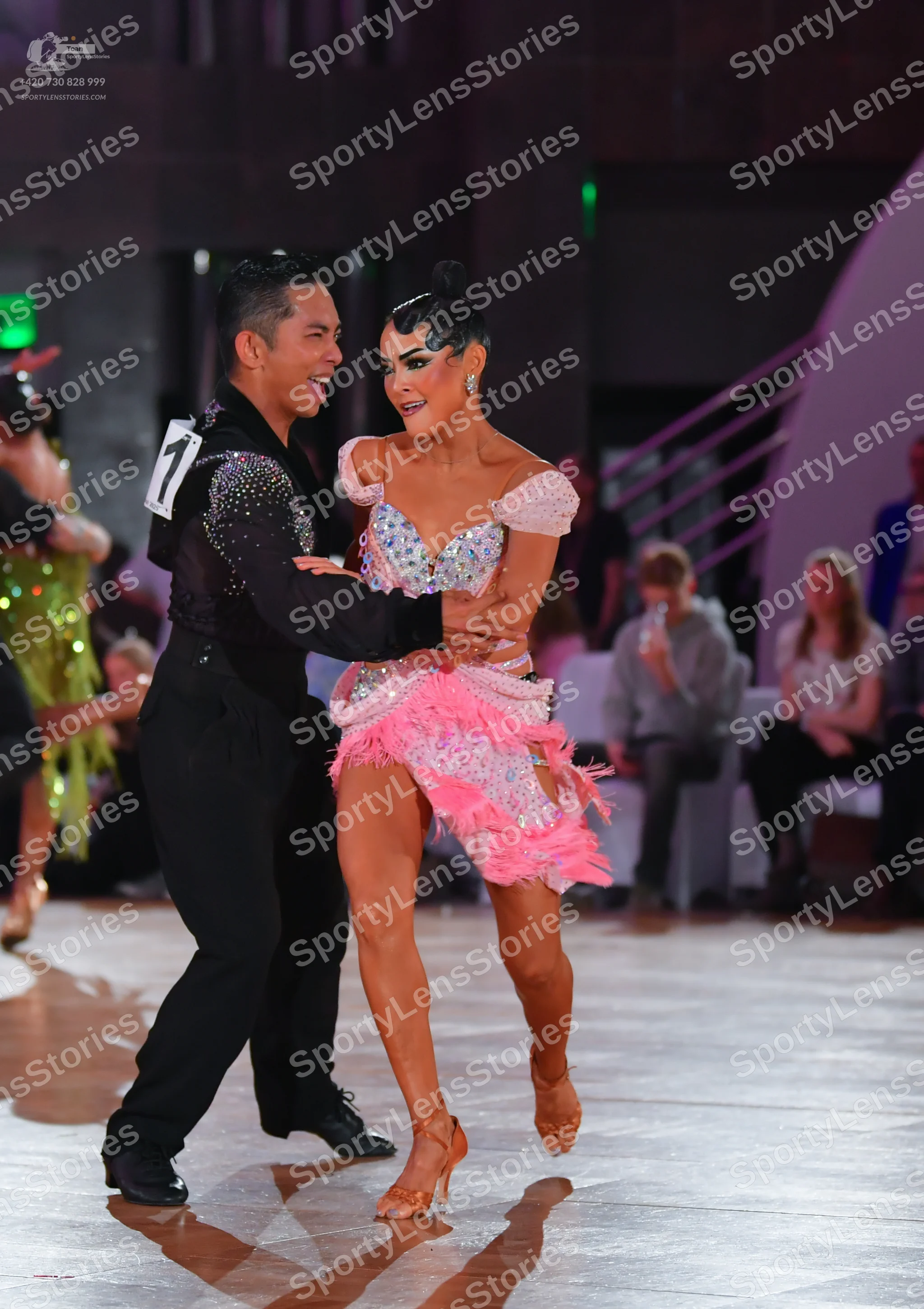 Dancesport competitor: Male dancer: black long-sleeved shirt with silver sequins on the shoulder and bl