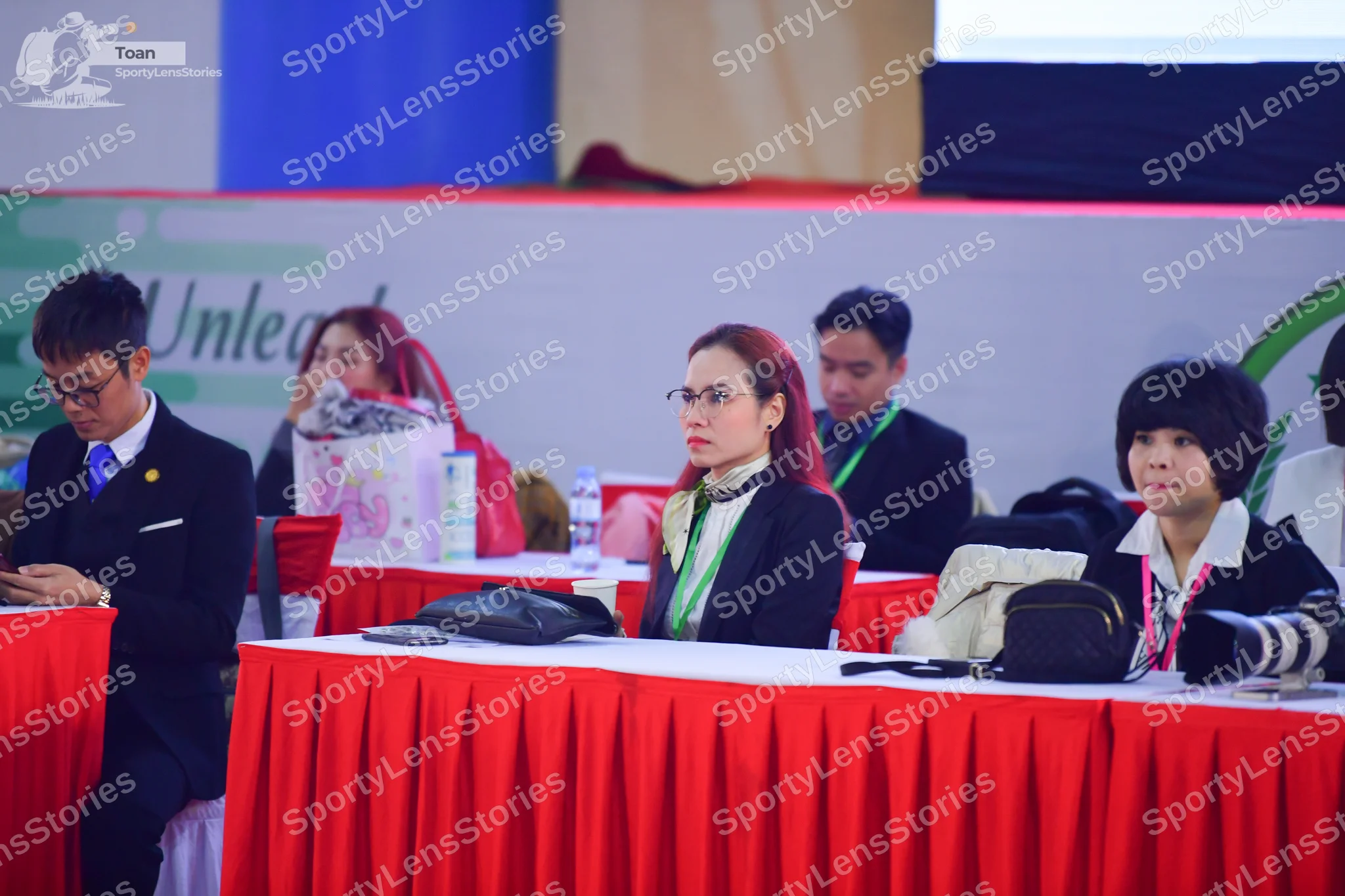 Dancesport competitor: Male:** Black suit with a white shirt and a green tie
