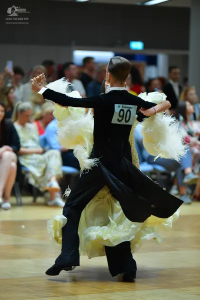 Dancesport competitor #90: Male dancer: black long-sleeved top and black trousers