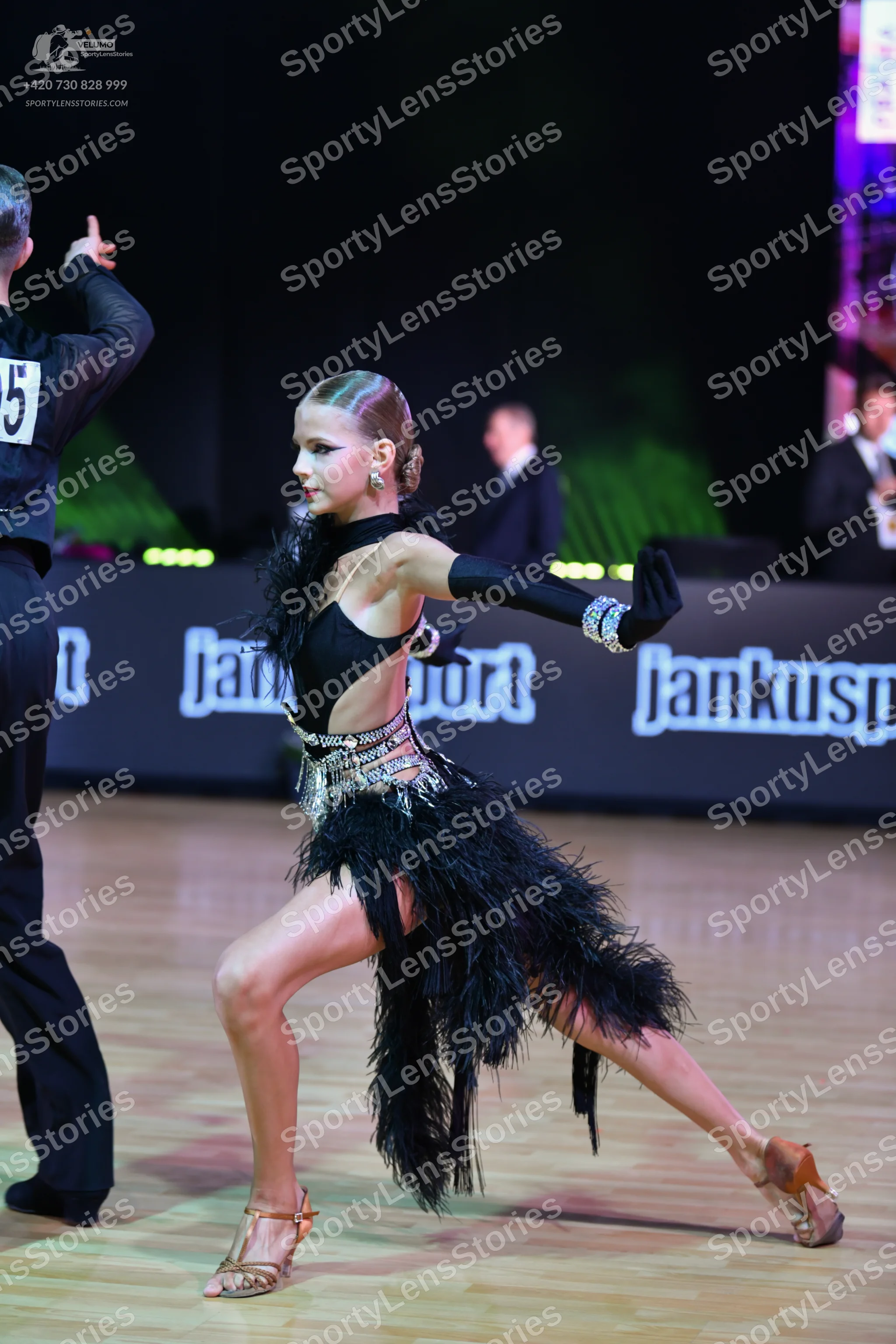 Dancesport competitor: Male dancer: black long-sleeved shirt and black trousers