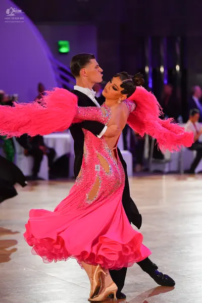 Dancesport competitor: Male dancer: black ballroom suit with a white shirt