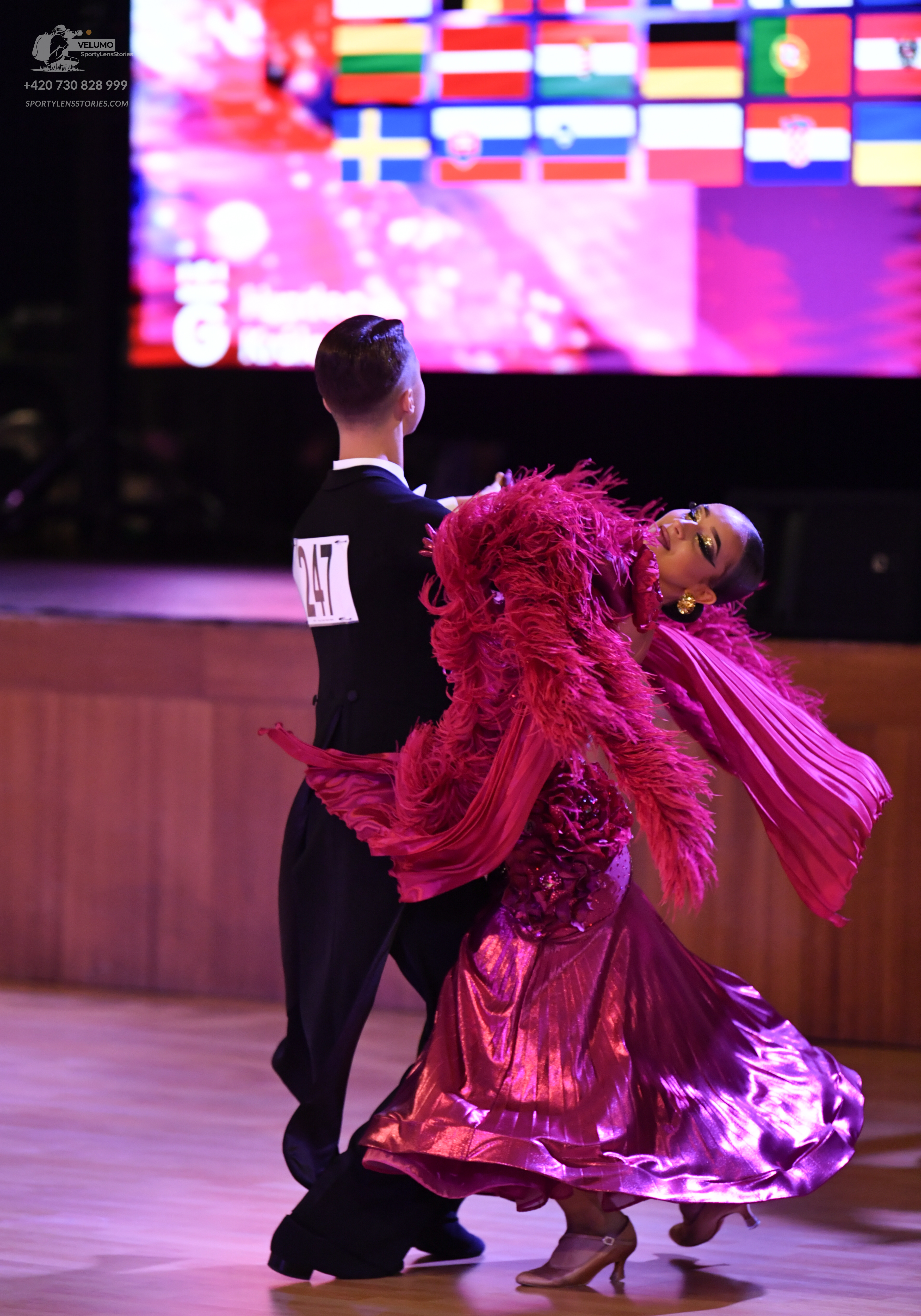 Dancesport competitor: ** Black suit with a wide, sequined lapel