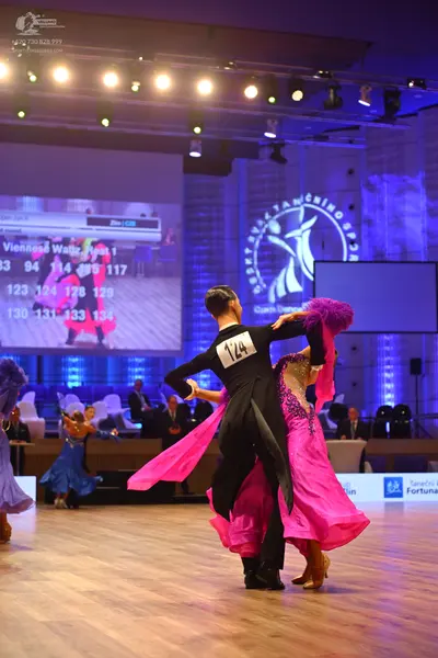 Dancesport competitor: Male dancer: black ballroom suit