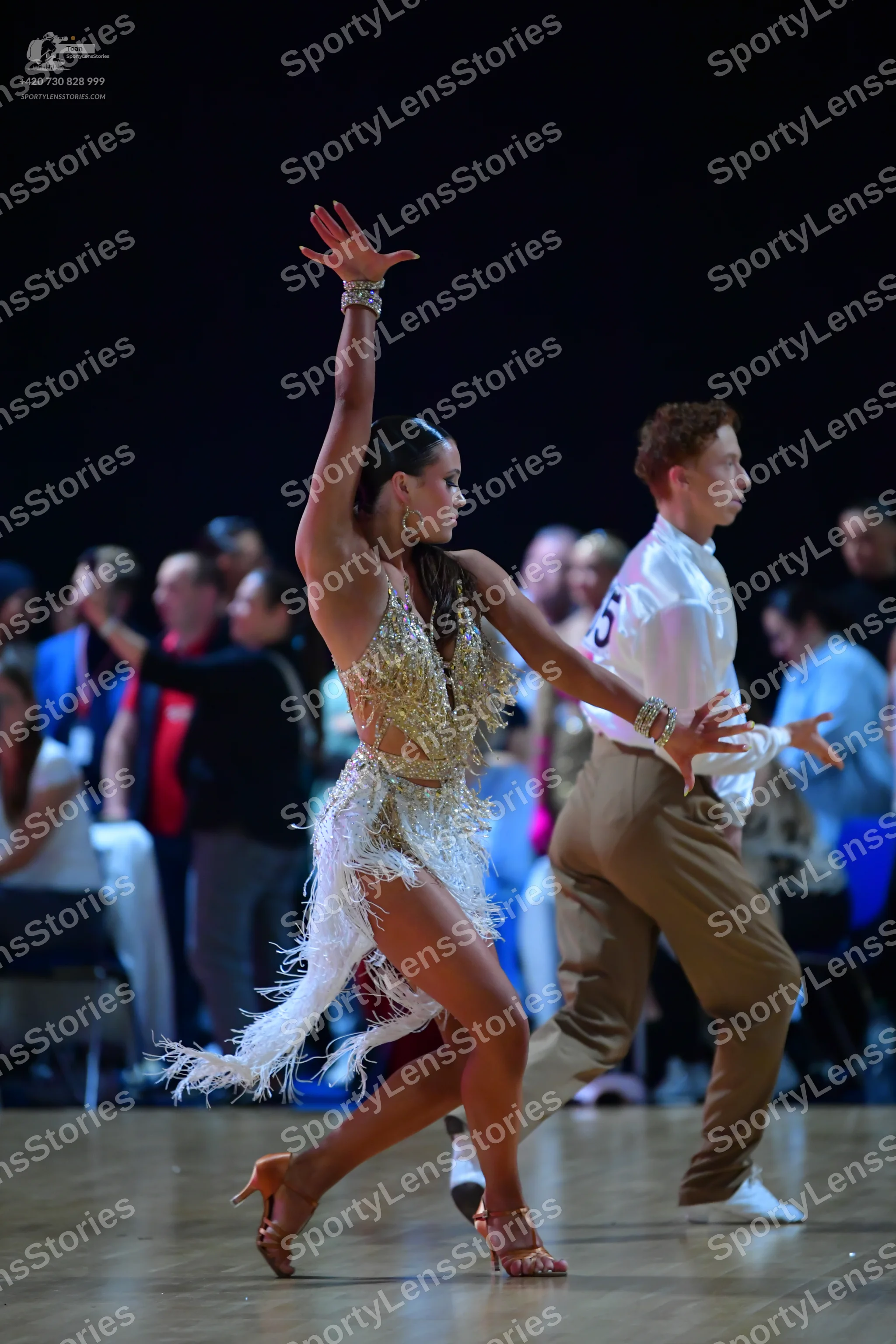 Dancesport competitor: Female dancer: gold/nude latin dress with heavy sequin and bead embellishments a
