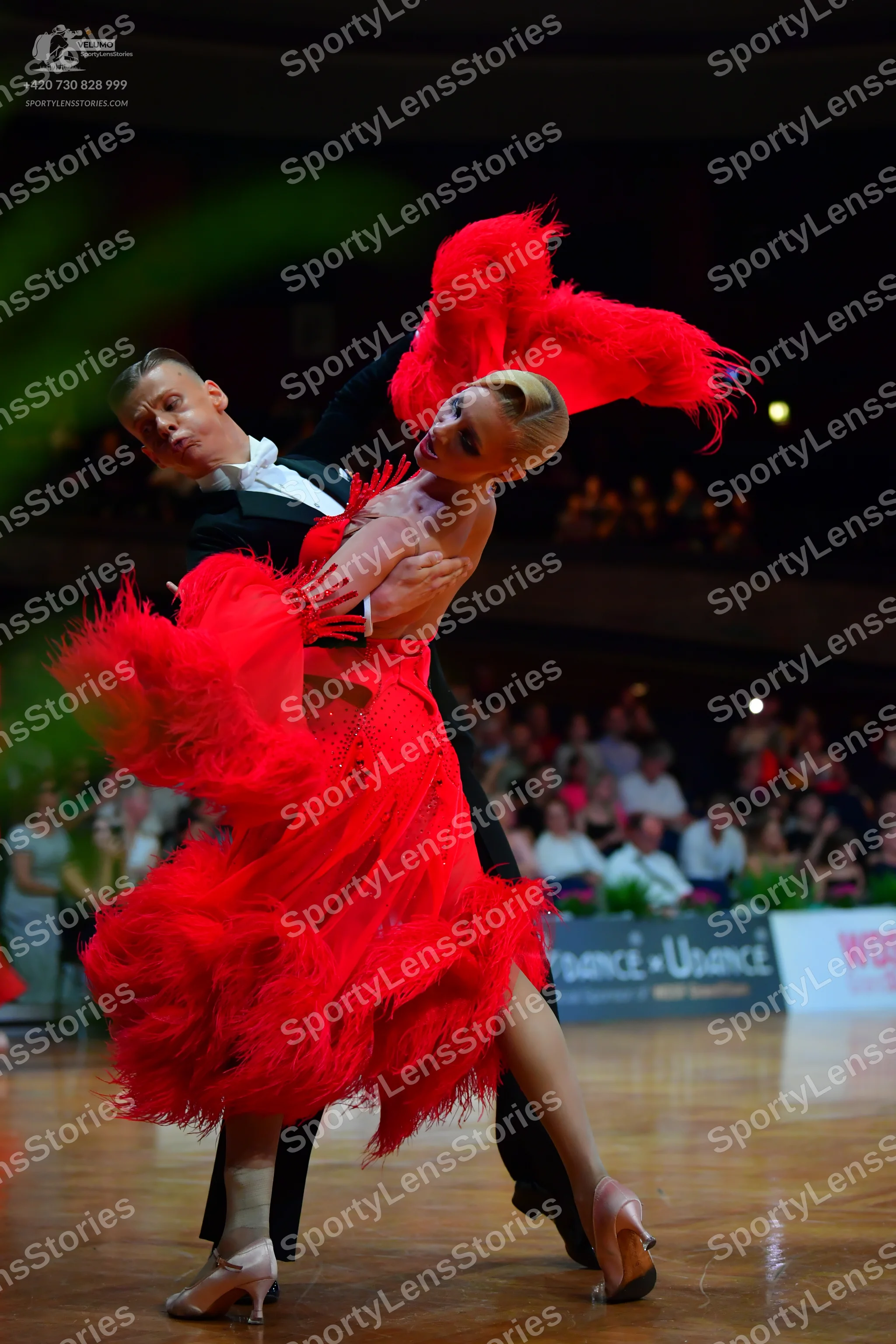 Dancesport competitor: Male dancer: black tuxedo with a white shirt and black bowtie