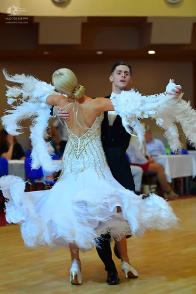 Dancesport competitor: Male dancer: black suit