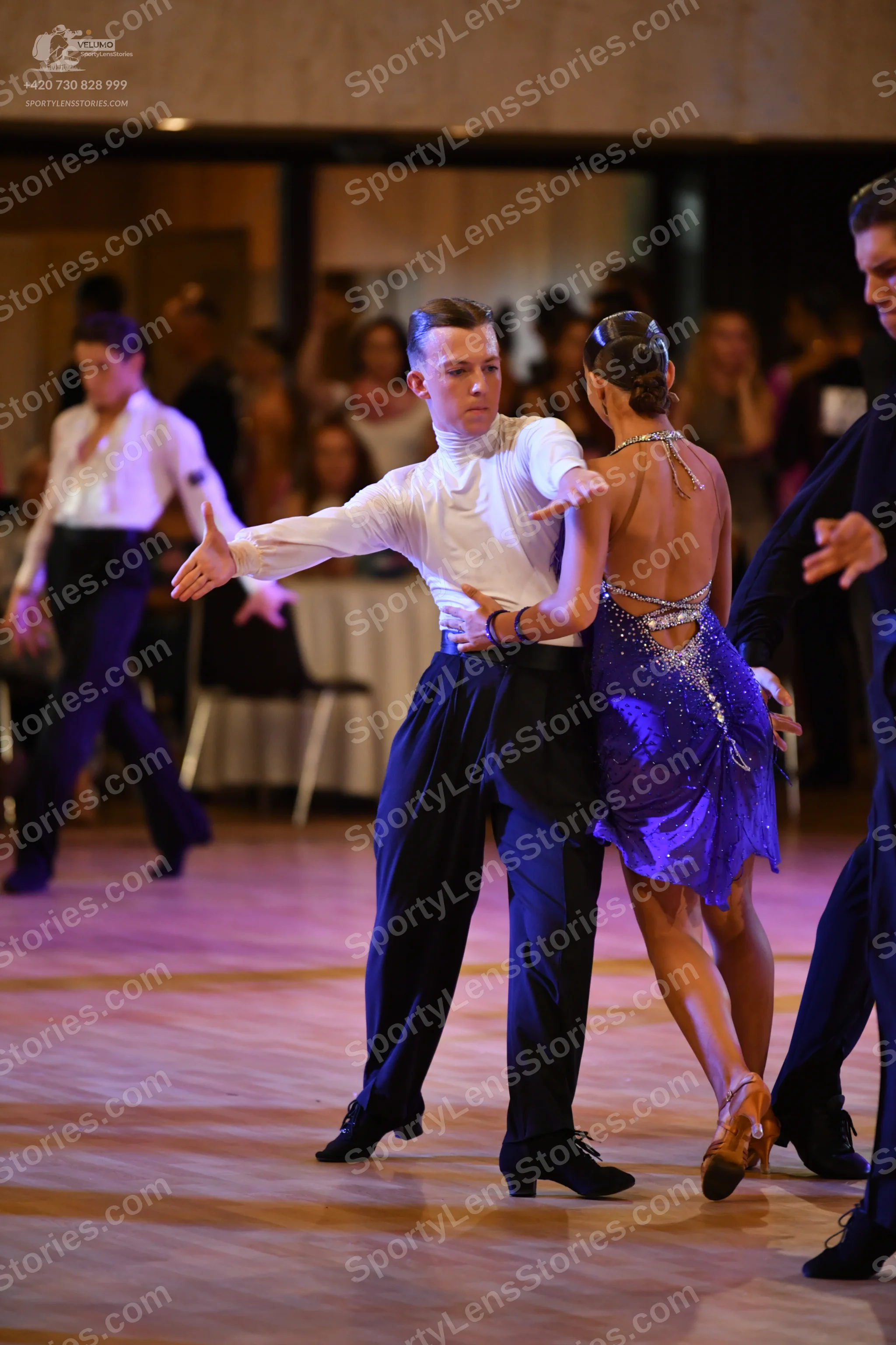 Dancesport competitor: ** Black suit with a sequin lapel
