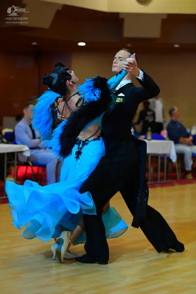 Dancesport competitor: Male dancer: black suit