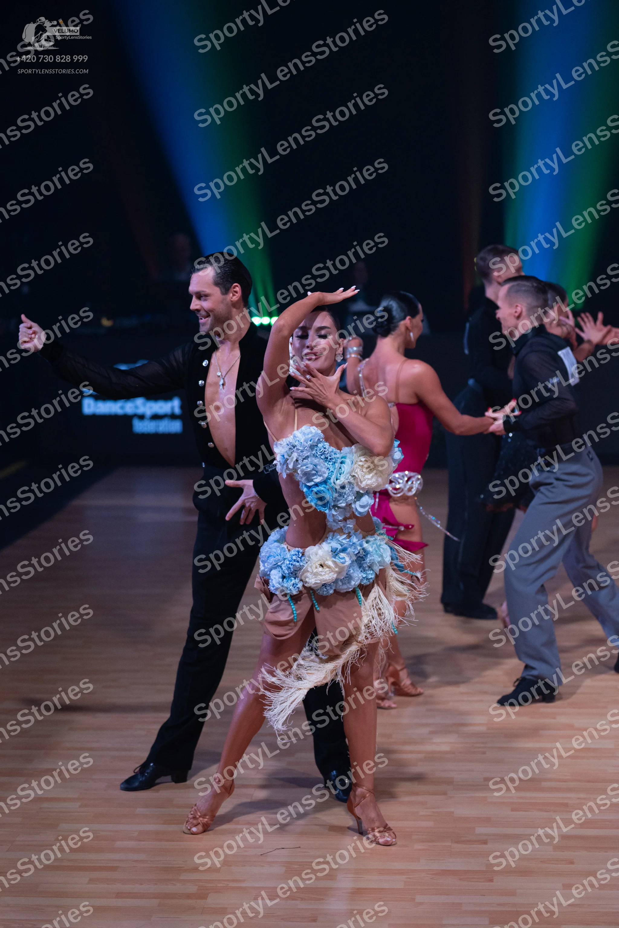 Dancesport competitor: Male dancer (front): black long-sleeved latin dance shirt and black trousers