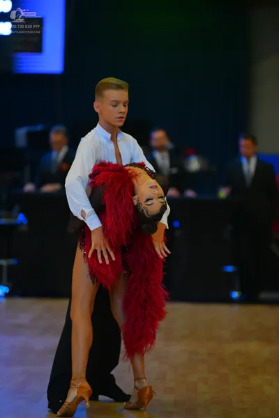Dancesport competitor: Male dancer: white long-sleeved shirt and black trousers