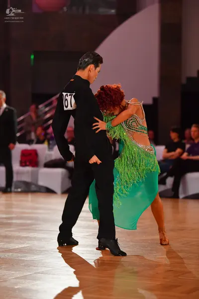 Dancesport competitor #67: Male dancer: black long-sleeved shirt and black trousers