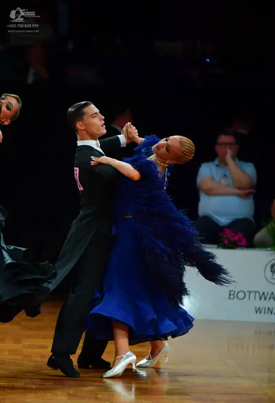 Dancesport competitor: Male dancer: black tailcoat, white shirt, and white bow tie