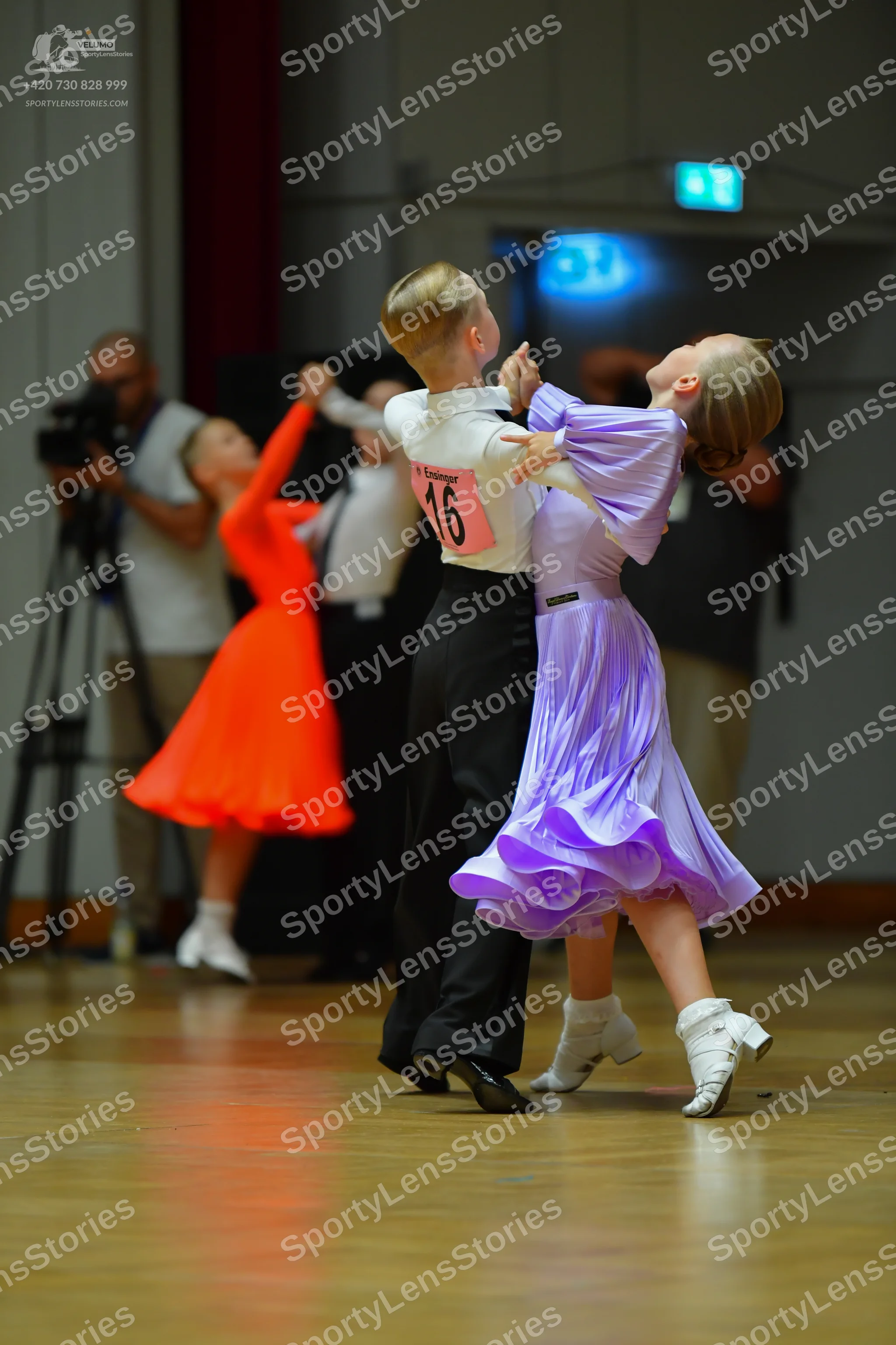 Dancesport competitor #16: Male dancer in foreground: white shirt and black trousers