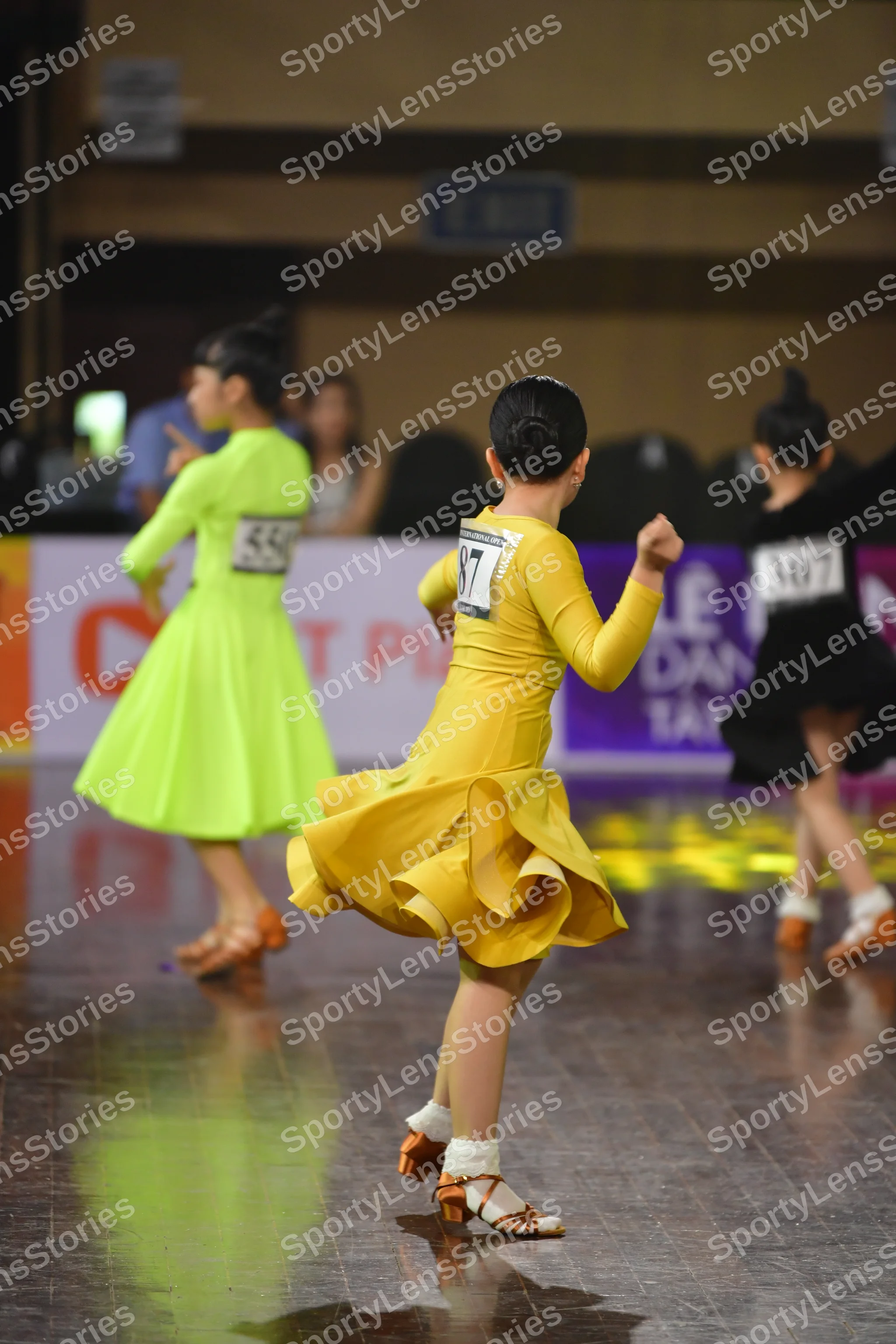 Dancesport competitor #36, #77: Lime green dancer: neon green latin dress with a short skirt