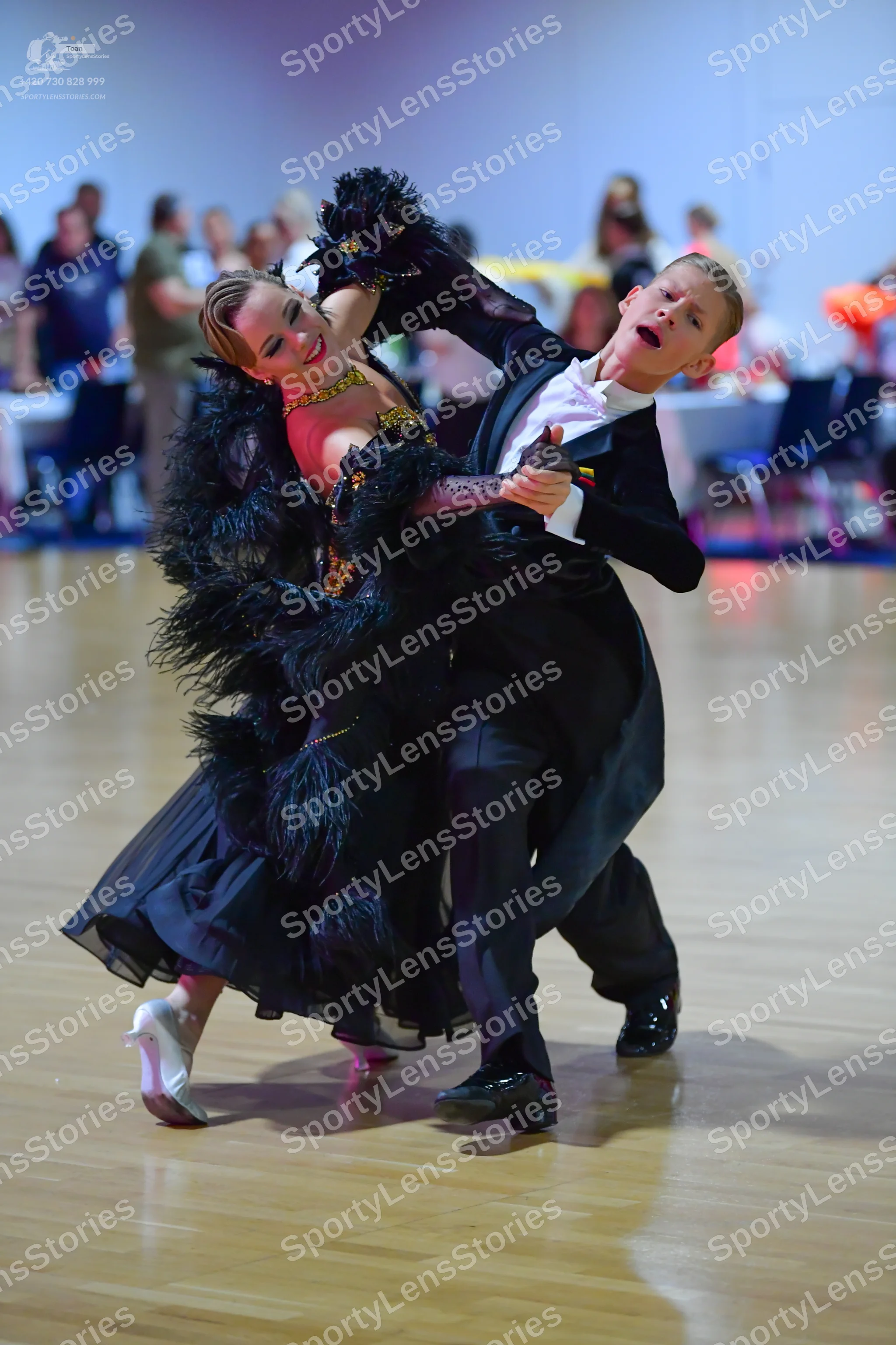 Dancesport competitor: Male dancer: black ballroom tailcoat, white shirt, and black trousers